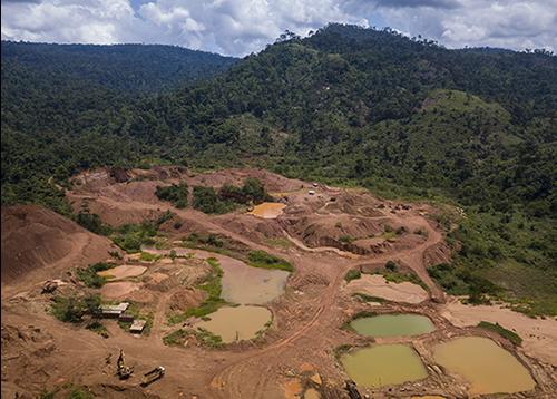 A legal gold mine in Ghana shows some of the effects mining has on the landscape and environment. Illegal mines, which operate without environmental oversight, are often situated close to legal ones, and the water pools are more irregular or divert to small rivers. Ghanaian officials have shut down illegal gold mines they identified using NASA satellite data and NASA-developed analysis tools. Credit: Jordi Perdigó/Global Partnership for Sustainable Development Data A legal gold mine in Ghana
