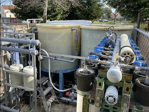 In the gray water reclamation system at Ames Research Center’s Sustainability Base, the two beige Aquaporin HFFO14 forward-osmosis modules on the left have as much filtration capacity as the entire legacy system on the right. Credit: Aquaporin A/S The gray water reclamation system at Ames Research Center’s Sustainability Base