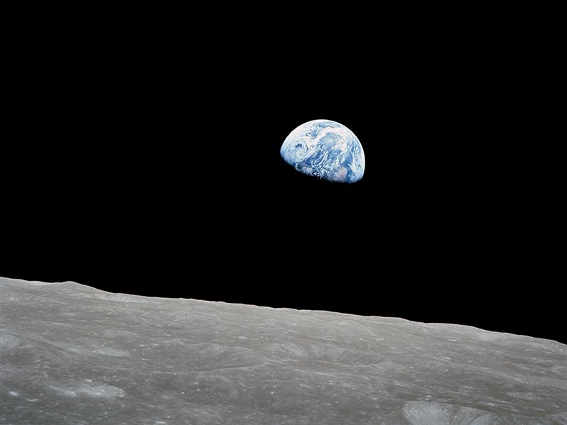 The first photo of Earth rising over the horizon of the moon