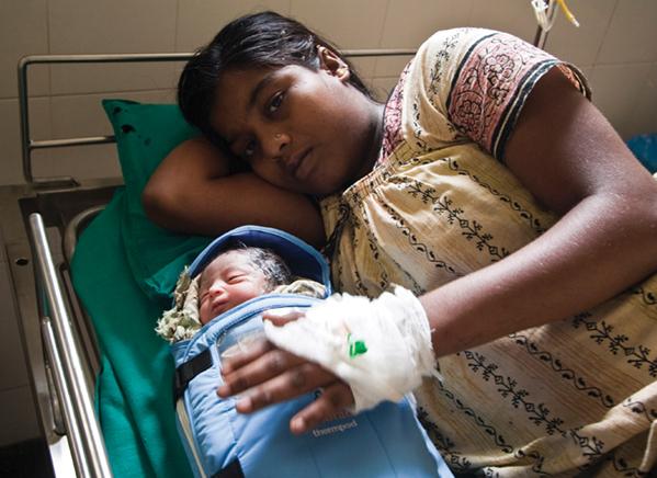 Embrace Innovations’ product line spun out of an MBA-student project to supply baby warmers to populations lacking access to modern medical care. Today, every item purchased from the company results in a warmer donated to an infant in need. Mother and baby in clinic