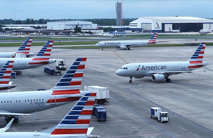 Holding airplanes at the gate until just before takeoff allows them to run power supplied by the airport. American Airlines saved millions of gallons of fuel and maintenance costs and tons of harmful emissions by only running engines when arriving at and leaving the gate. Credit: American Airlines Inc. American Airlines planes holding at the gate
