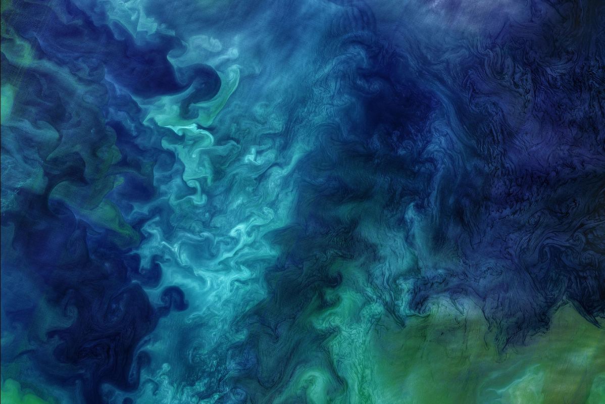 Phytoplankton blooms form striking patterns of blue and green seawater in this image of the Chukchi Sea acquired on June 18, 2018, by the Operational Land Imager (OLI) on Landsat 8