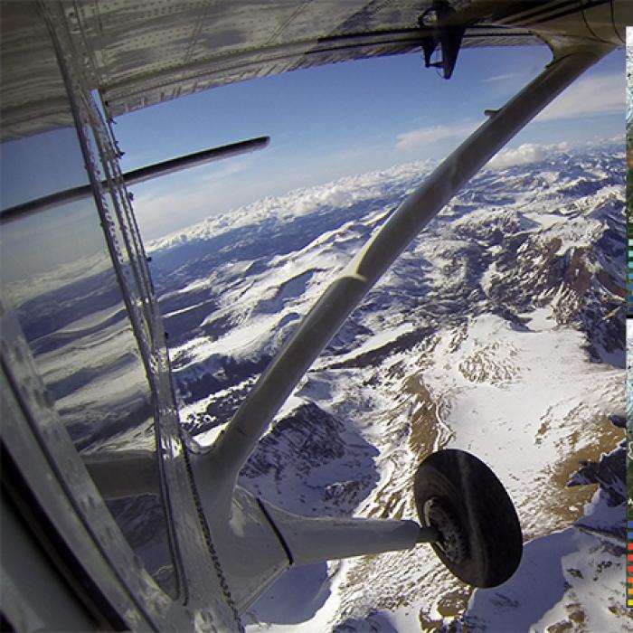 A plane from NASA’s Airborne Observatory mission flying over mountains in Yosemite National Park
