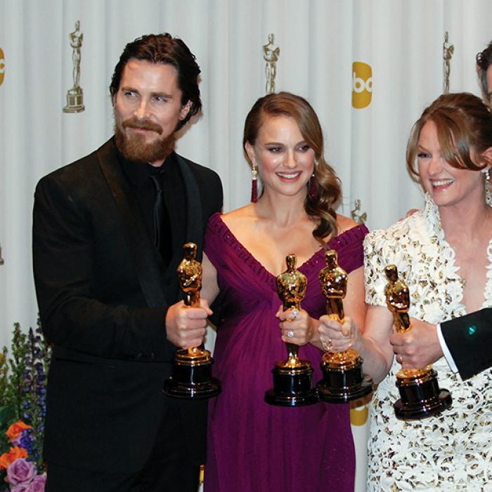 Christian Bale, Natalie Portman, Melissa Leo, and Colin Firth holding Oscars
