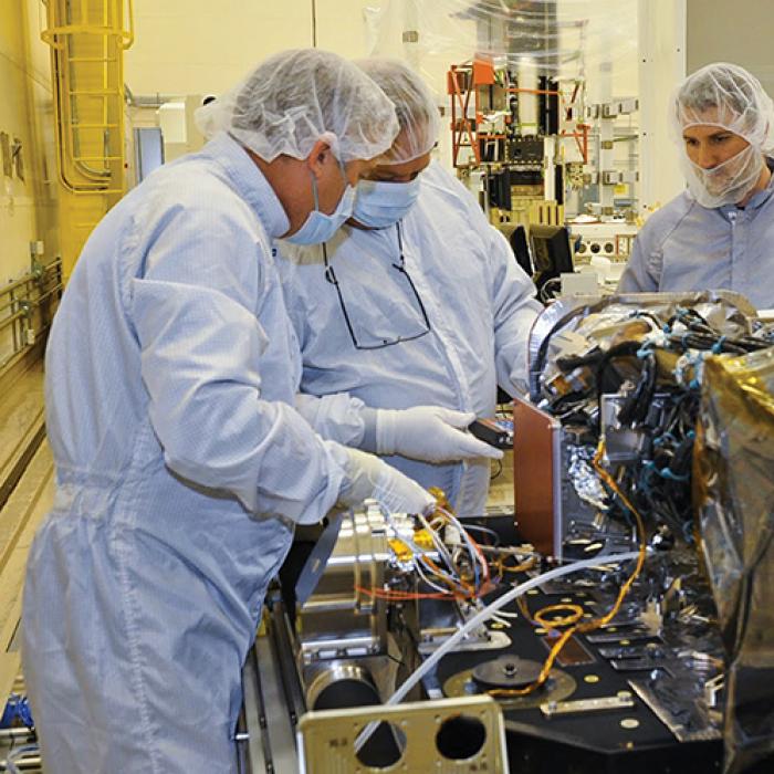 Engineers working on the Geostationary Operational Environmental Satellite-R