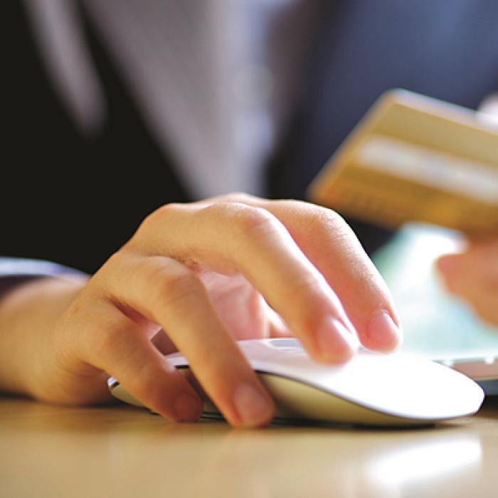 SHINE, an artificial intelligence program NASA designed to monitor the health of space systems, is now being used to determine the intent and sentiment of Internet users to better target advertising. Woman with credit card and computer mouse