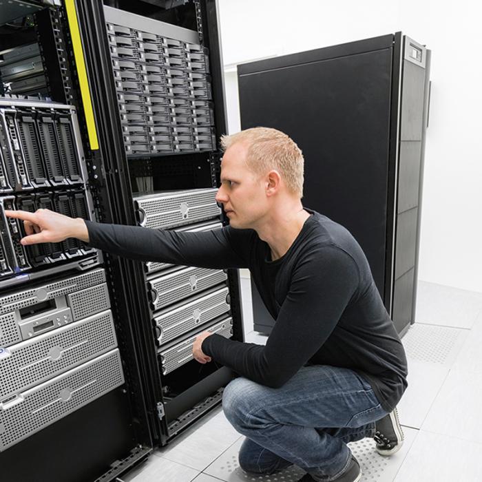 Engineer inspecting data center