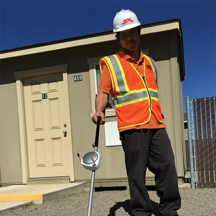 Scientist with methane sensor