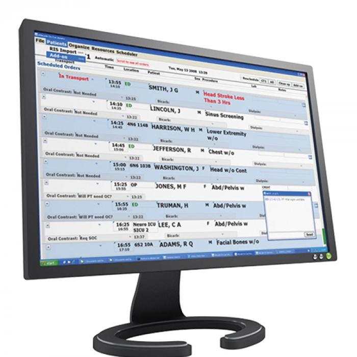 A computer monitor displays names and medical procedures