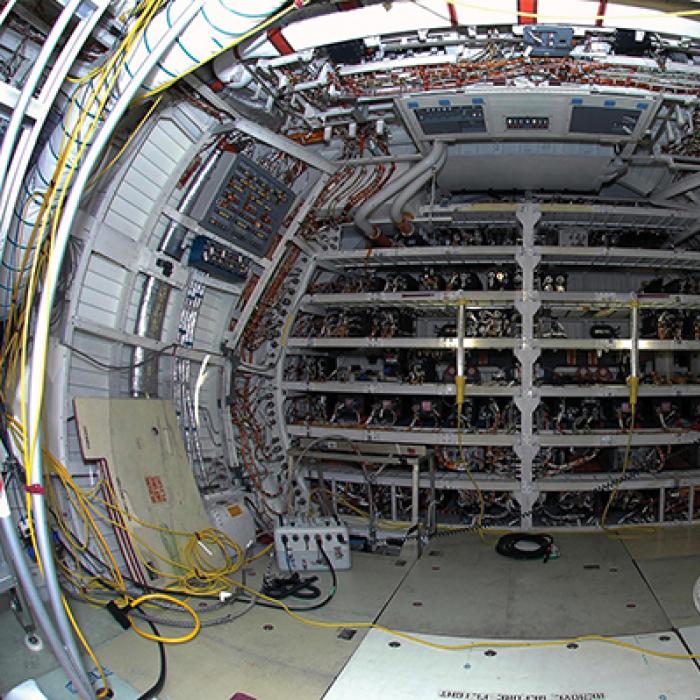 Space shuttle interior with electrical wiring exposed