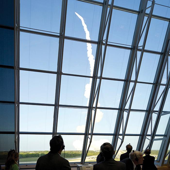 NASA staff watching space shuttle launch