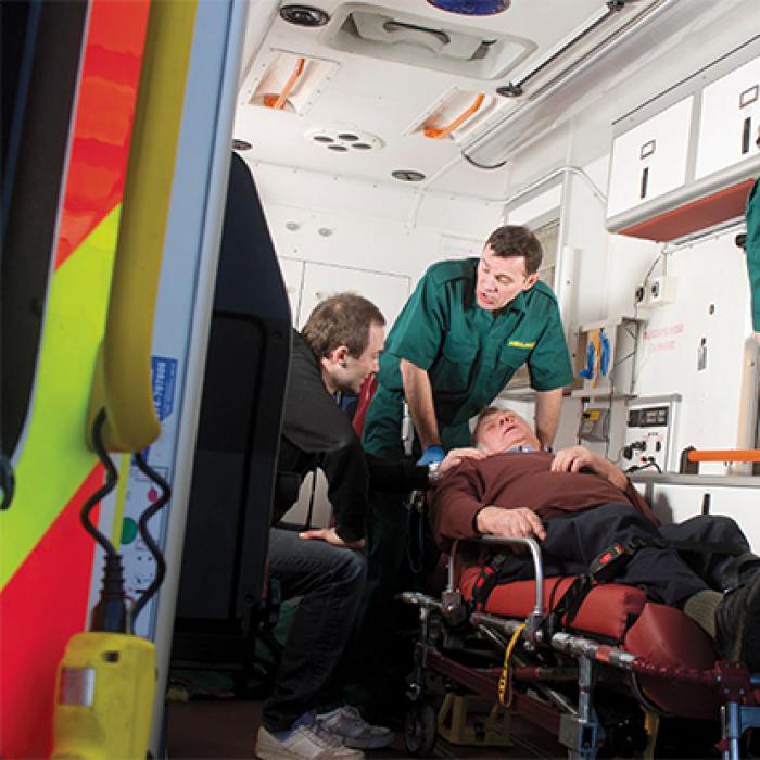 Emergency response personnel treat a patient