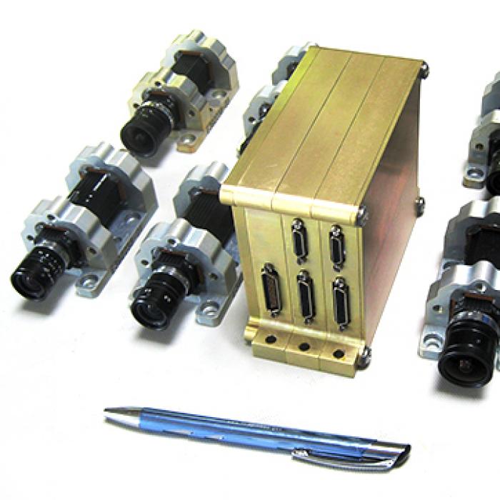 Smaller, more capable RocketCam Digital Video Systems such as this will be used onboard future NASA, commercial, and defense rockets and spacecraft. Credit: Ecliptic Enterprises Corporation An eight-camera digital video system with a pen for size comparison