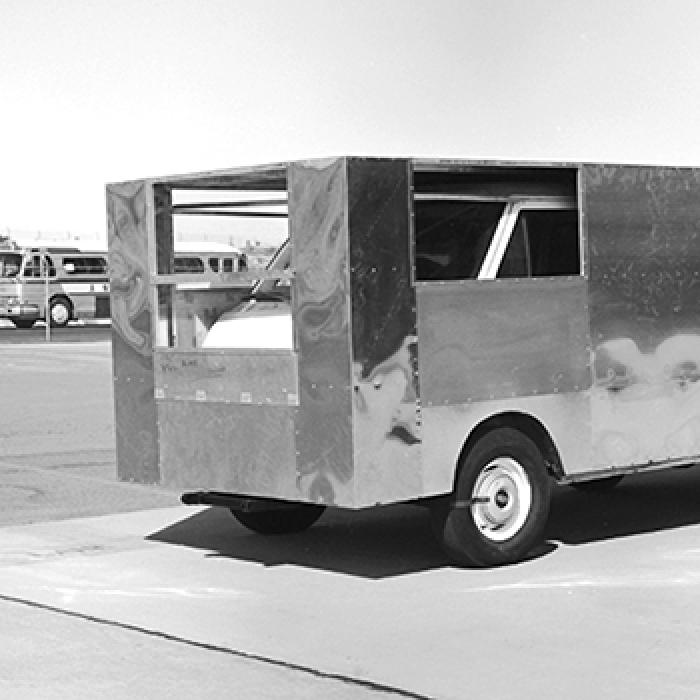 A delivery van boxed in aluminum sheets tests aerodynamic drag.