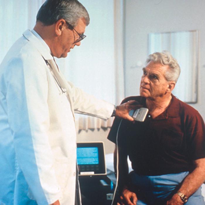 A physician checks a patient's advanced Trilogy pacemaker.