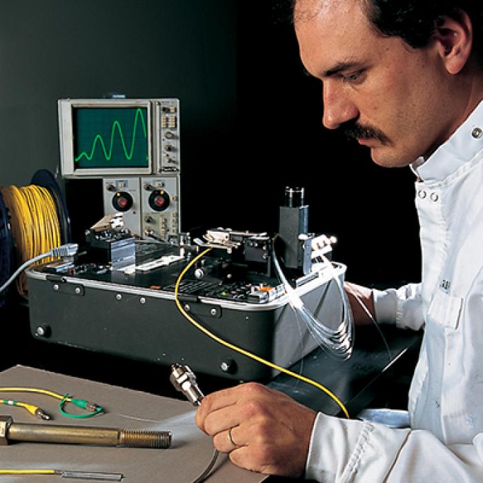 Technician mounts FFPI Industries' fiber optic sensors in an engine