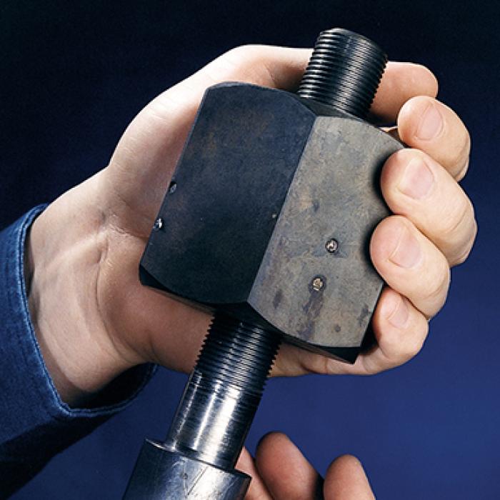 Two hands holding the quick connect nut licensed by M&A Screw and Machine Works
