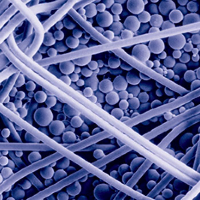 An electromicrograph shows the microencapsulated phase change materials in the insulation