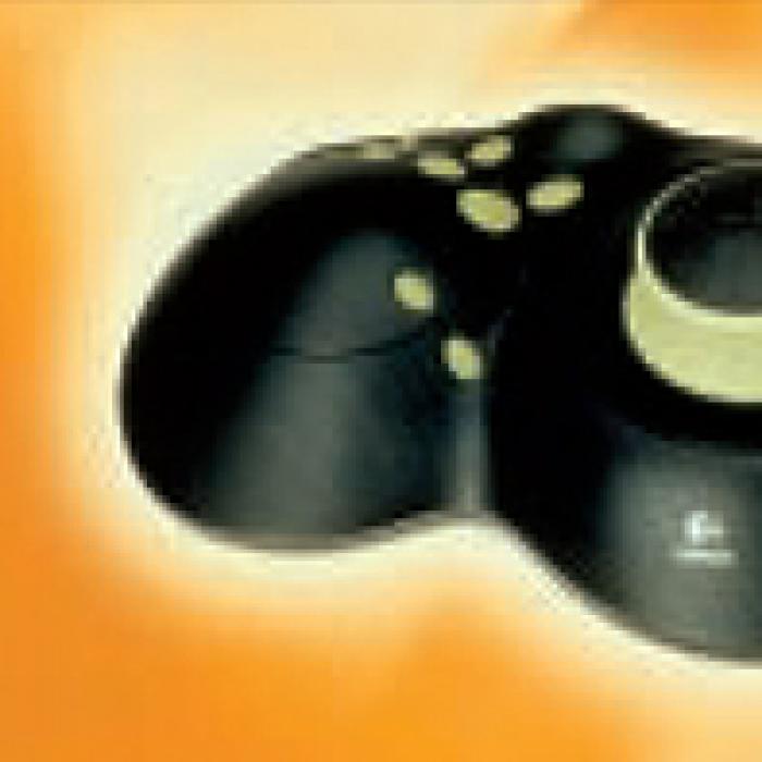 Digital video game controller on an orange background