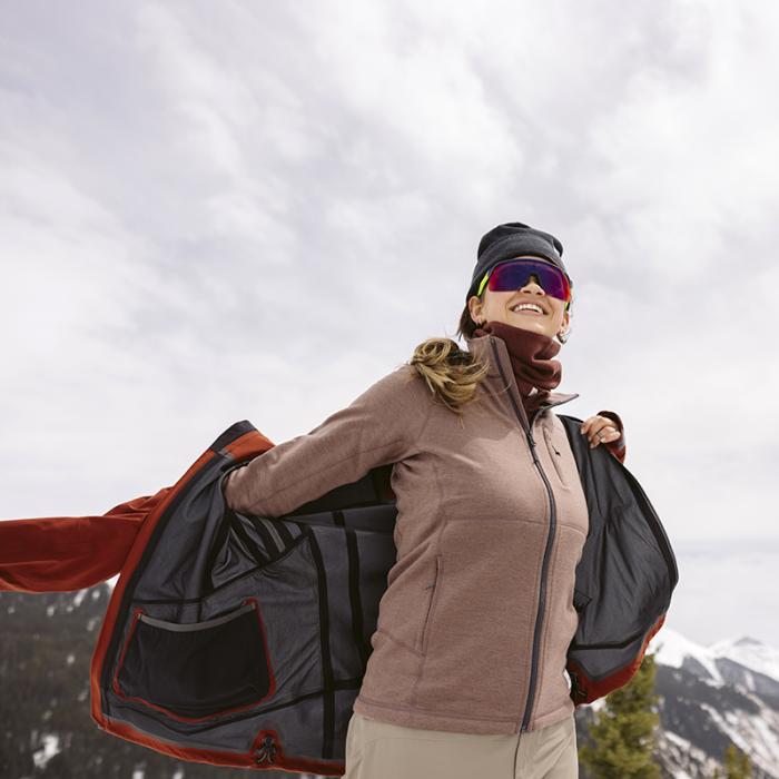 Skiers wear Artilect Systems winter apparel items