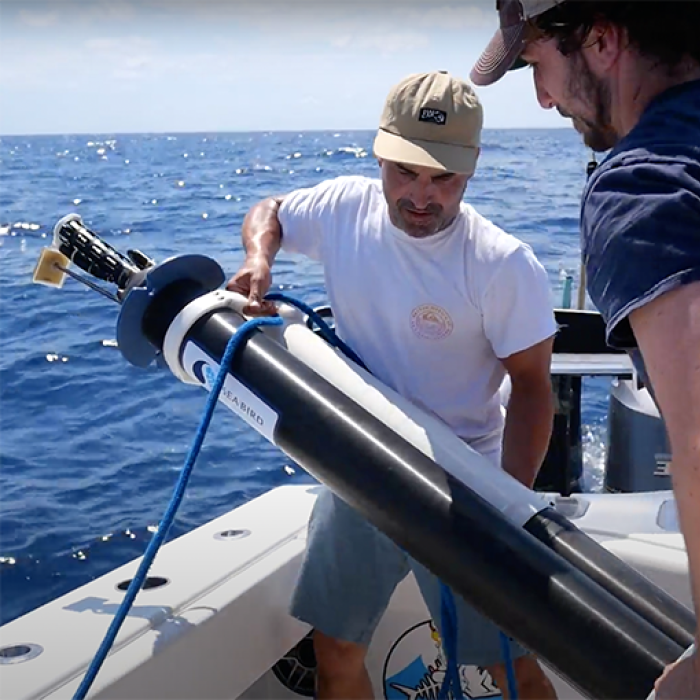 From left, Michael Zedelmair and Miles Mallinger, both of Seatrec, deploy a float with one of the company’s SL1 power modules in the Gulf of Mexico