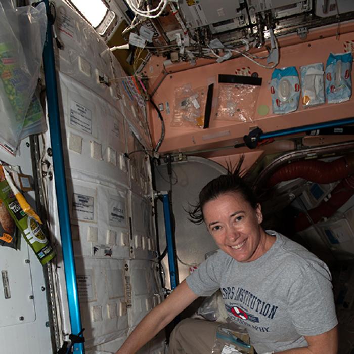 NASA astronaut Megan McArthur collects microbial samples from surfaces inside the space station