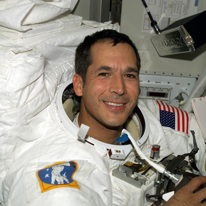 Astronaut John B. Herrington wears a spacesuit aboard the International Space Station in 2002