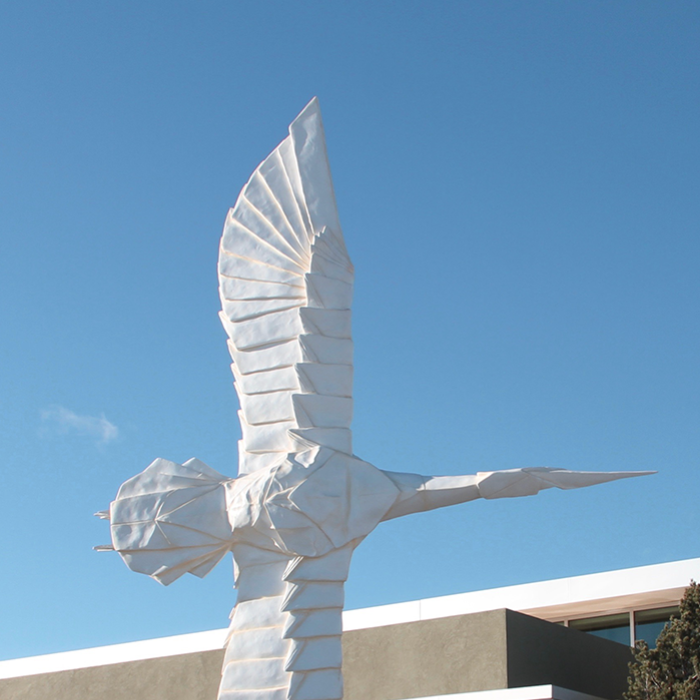 “Flying Peace,” a collaboration between origami artist Robert Lang and sculptor Kevin Box, stands outside White Rock Branch Library near Los Alamos, New Mexico
