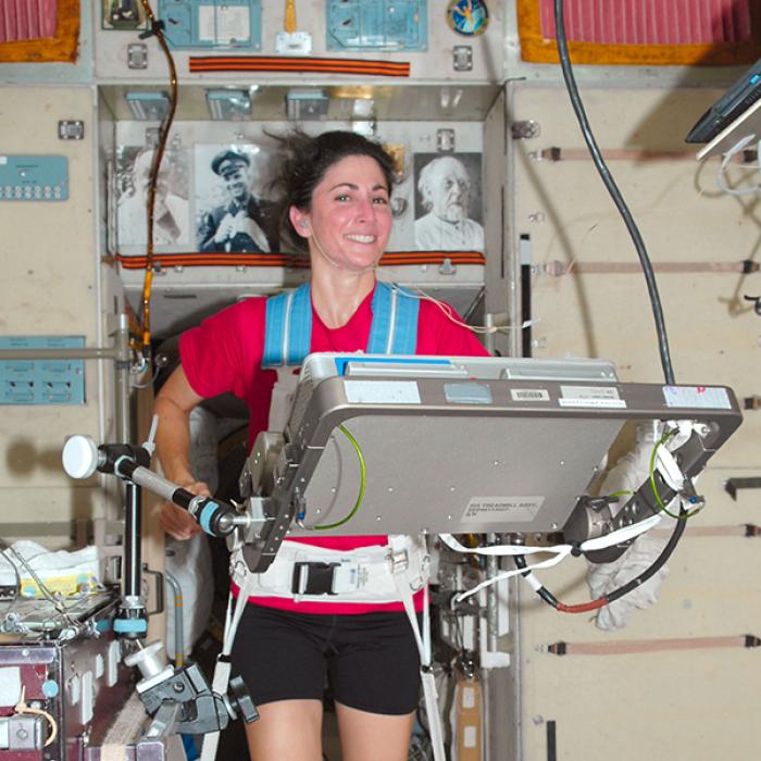 NASA astronaut Nicole Stott works out on a treadmill on the International Space Station