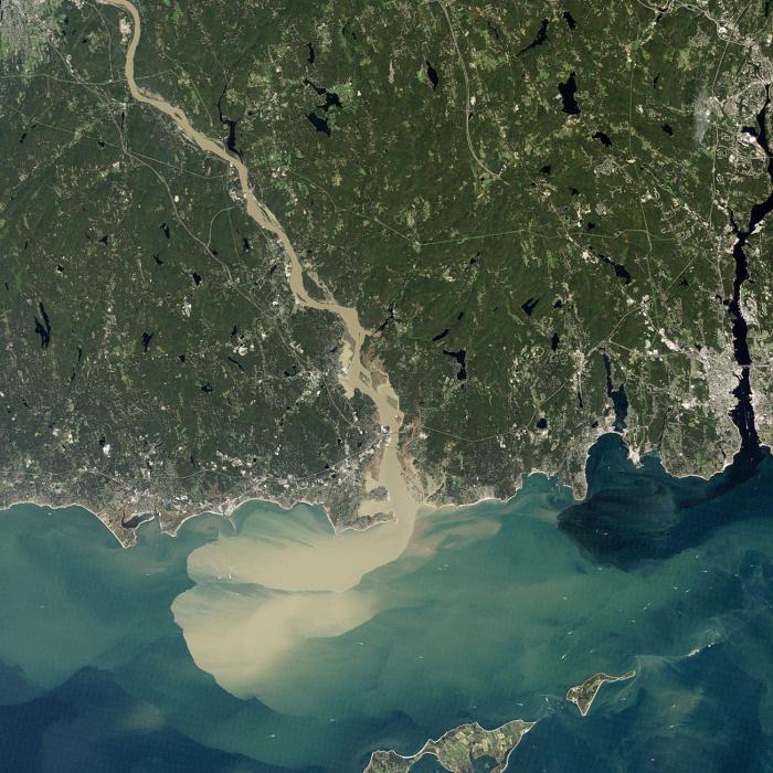 satellite view of river mouth emptying into a body of water