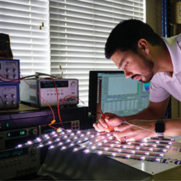 BiOS Lighting vice president Robert Soler works on an LED array in his lab