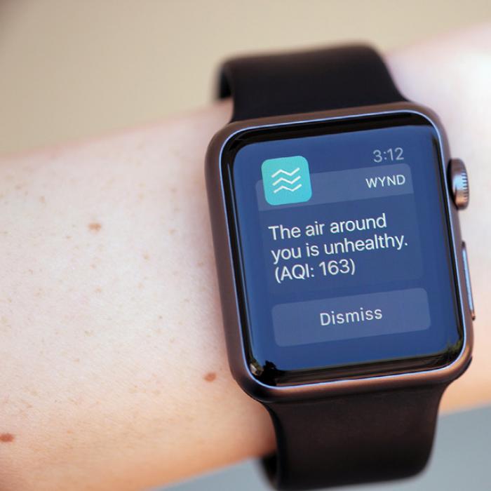 A smart watch displays the Wynd app