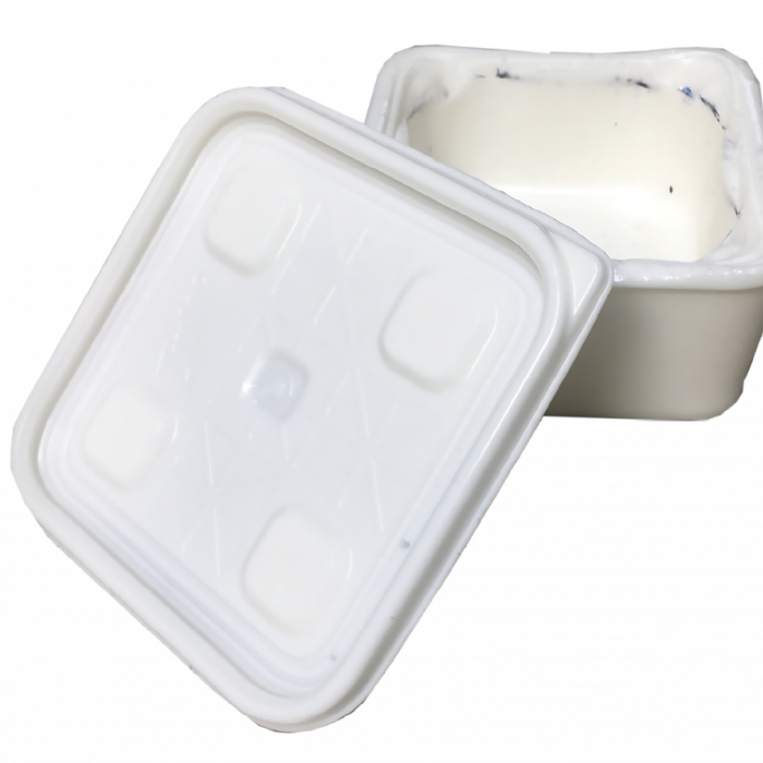 White container with lid askew