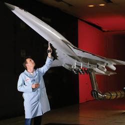 NASA engineer with model of High-Speed Civil Transport aircraft