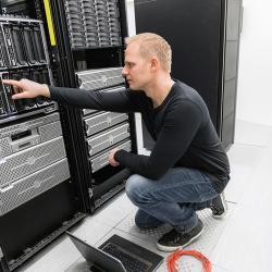 Engineer inspecting data center