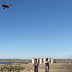 Technicians fly a drone outfitted with SeekOps’ methane detector