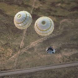 Orion’s parachutes deploy in stages. First, drogue chutes are deployed to stabilize and slow the spacecraft. Orion and its parachutes during test flight