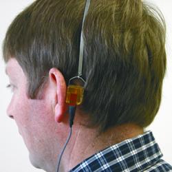 A man wearing hearing test equipment