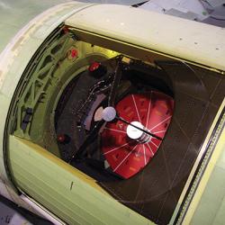 The infrared (IR) telescope of the Stratospheric Observatory for Infrared Astronomy (SOFIA) peers through the opening in the fuselage of its Boeing 747 mothership. NASA's SOFIA infrared telescope on board its airplane mothership