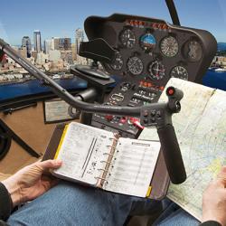pilot with his hands off the controls while looking at maps