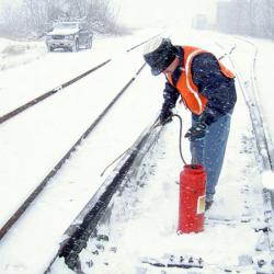 Train tracks being sprayed with Ice Free Switch