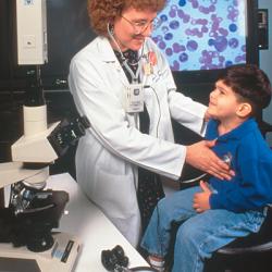 Dr. Terry Lightner transmits the sounds of a child's heart beating to a physician 250 miles away