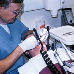 A dentist gives this patient the cleanest of water while dental tools do their work