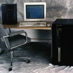 A computer simulation processor pictured against a smaller computer workstation to show scale