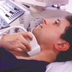 A patient getting an ultrasound of his neck