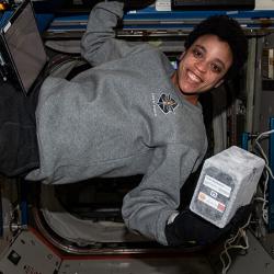 Astronaut Jessica Watkins holds a Nature’s Fynd bioreactor on the International Space Station