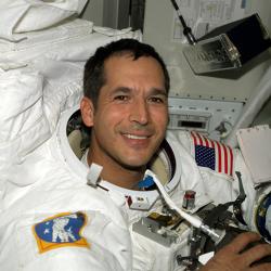 Astronaut John B. Herrington wears a spacesuit aboard the International Space Station in 2002