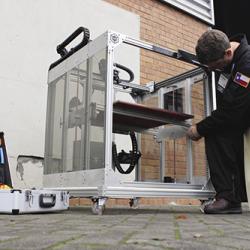 The founders of re:3D drew on experience at Johnson Space Center to design and sell a large-scale 3D printer at a low cost. Thestandard configuration prints items up to eight cubic feet, or 30 times larger than competing desktop models. Technician working on 3D printer