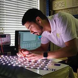 BiOS Lighting vice president Robert Soler works on an LED array in his lab