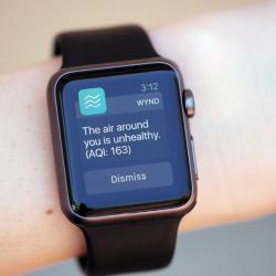 A smart watch displays the Wynd app